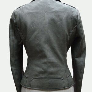 May include: A dark gray leather jacket with a zipper closure and a fitted silhouette.