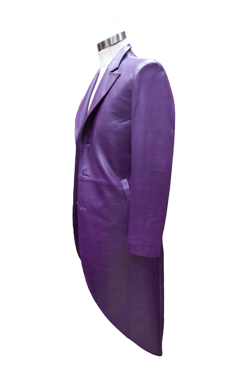 May include: A purple long-sleeved jacket with a tailcoat style. The jacket has a single-breasted closure with buttons and a pointed collar.