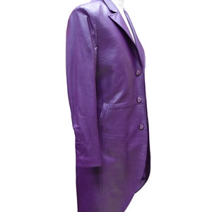 May include: A long, purple leather jacket with a single-breasted closure and a tailcoat-style back.
