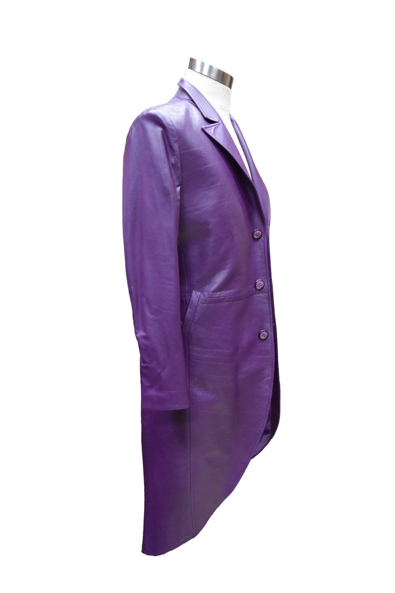 May include: A long, purple leather jacket with a single-breasted closure and a tailcoat-style back.