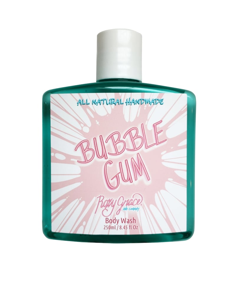 May include: A green plastic bottle of bubble gum scented body wash. The label says "All Natural Handmade Bubble Gum" and "Roxy Grace Co. Body Wash 250ml / 8.45 fl oz."