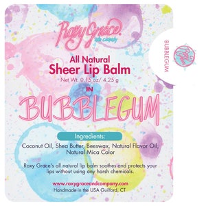 May include: A rectangular label for Roxy Grace and Company All Natural Sheer Lip Balm in Bubblegum. The background features a colorful watercolor splatter design. Text includes ingredients like coconut oil, shea butter, and beeswax, net wt 0.15 oz.