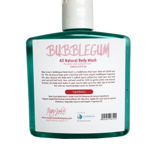 May include: A green plastic bottle of Bubblegum All Natural Body Wash. The bottle is labeled with the product name, ingredients, and a description of the product. The bottle is 8.45 fluid ounces and is paraben and sulfate-free.