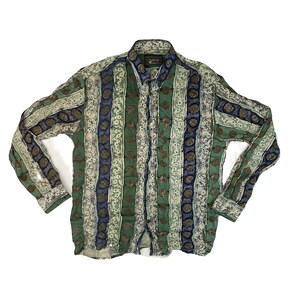 May include: Button-down shirt with a vertical striped pattern in shades of green, blue, and beige. The long-sleeved shirt features a collared neckline and a button-up front. The fabric has a subtle floral and circular design.