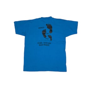 Vintage 80s quirky ‘Step by Step Daycare’ USA blue single stitch t-shirt size large