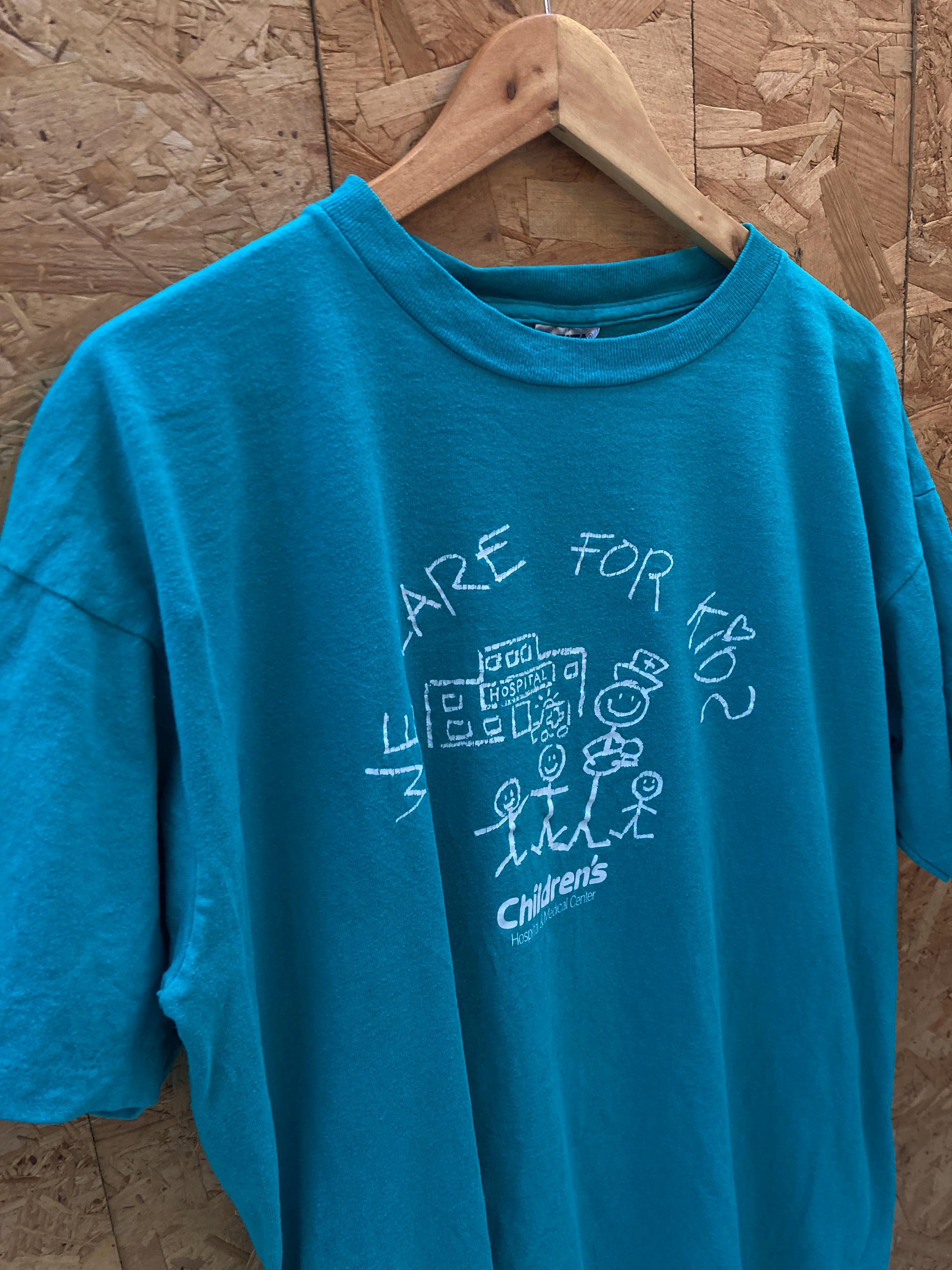 USA製幻80s 90sツイッギー TwiggyフォトヴィンテージTシャツキッズ Vintage 90s Quirky We Care for Kids Single Stitch Turquoise T