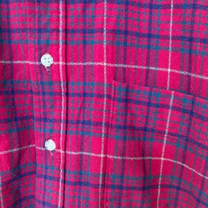May include: Red and blue plaid flannel shirt with a single chest pocket.