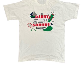 May include: White t-shirt with the text "If DADDY ain't happy ain't NOBODY happy" in red, blue, and green. The shirt features sailboat, golf, and tennis graphics. A casual tee for a dad.