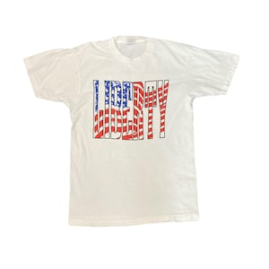 Vintage 90s USA flag liberty single stitch white souvenir t-shirt size large by Fruit of the loom | USA Vintage | Single Stitch T-Shirt