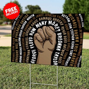 May include: Black and brown yard sign with a raised fist and the names of people who have died in police custody, including George Floyd, Breonna Taylor, and Ahmaud Arbery. The sign reads "How Many More?"