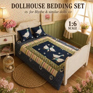 May include: Dollhouse bedding set for Blythe dolls. The set includes a white bed frame, two pillows, and a quilt. The quilt and pillows feature a navy blue background with white geese and small white stars. The bed is 1:6 scale.
