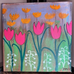 May include: A painting of a field of pink and orange flowers. The flowers are painted in a simple, stylized way. The background is a light blue with hints of green and purple. The painting is signed "Jami" in the bottom right corner.