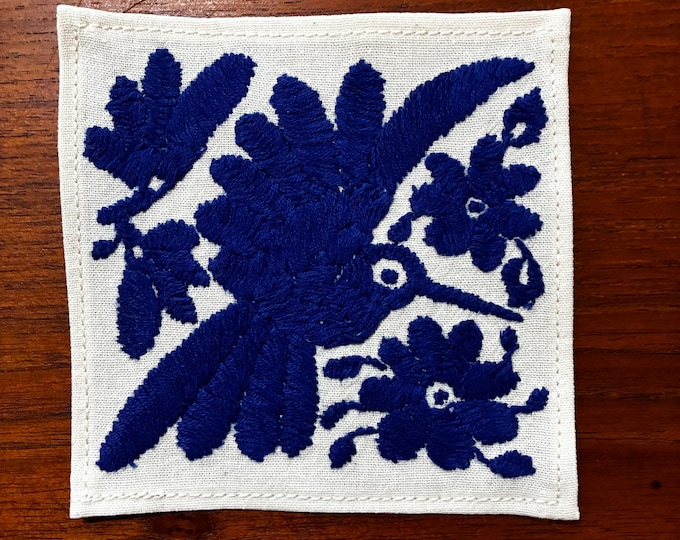Otomi hand embroidered muslin cotton coaster / cocktail napkin / frame-able art with blue bird and flowers. (4 1/4” x 4 1/4”)