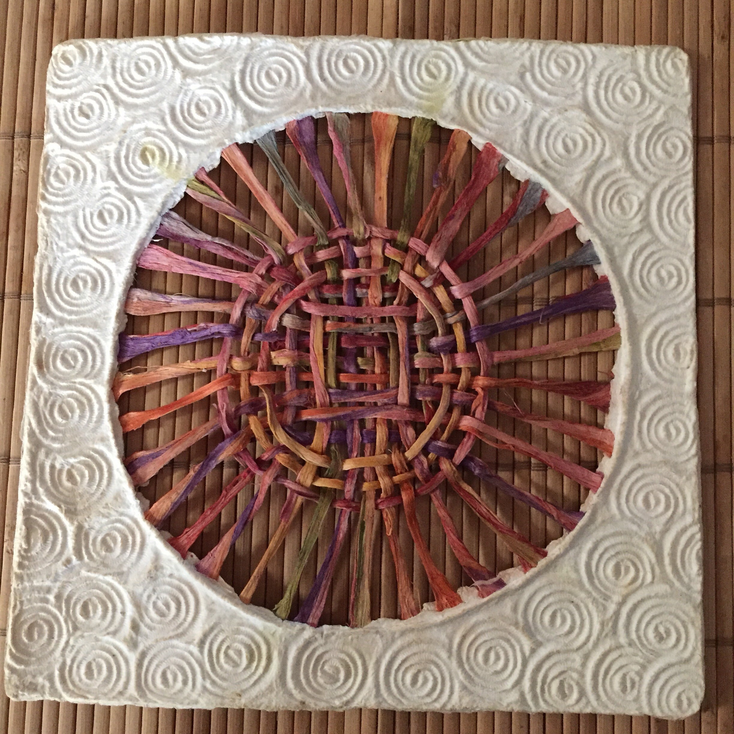 Handmade Amate Paper Wall Art with multicolor woven circle
