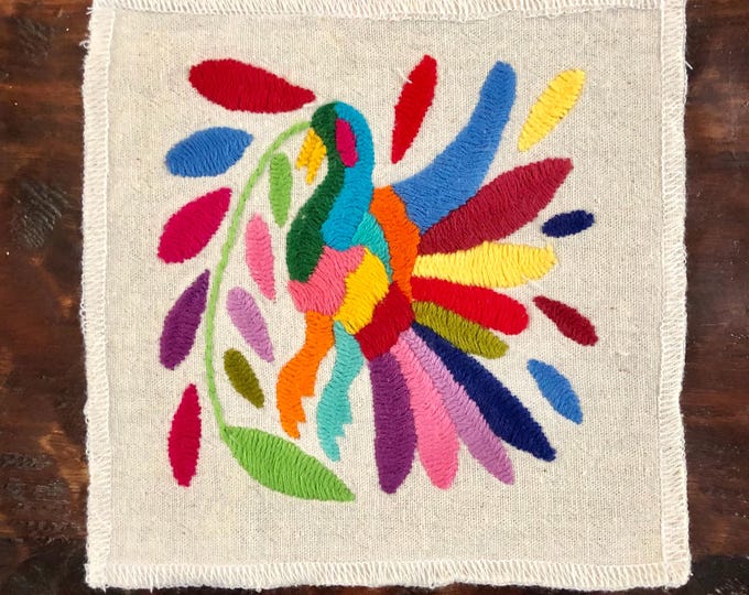 Otomi hand embroidered muslin coaster / cocktail napkin / frame-able art with multicolored bird and flowers.