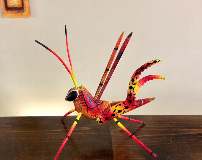 Alebrije Orange Grasshopper Handcrafted Wood Carving by Zeny Fuentes and Reyna Piña from Oaxaca, Mexico.