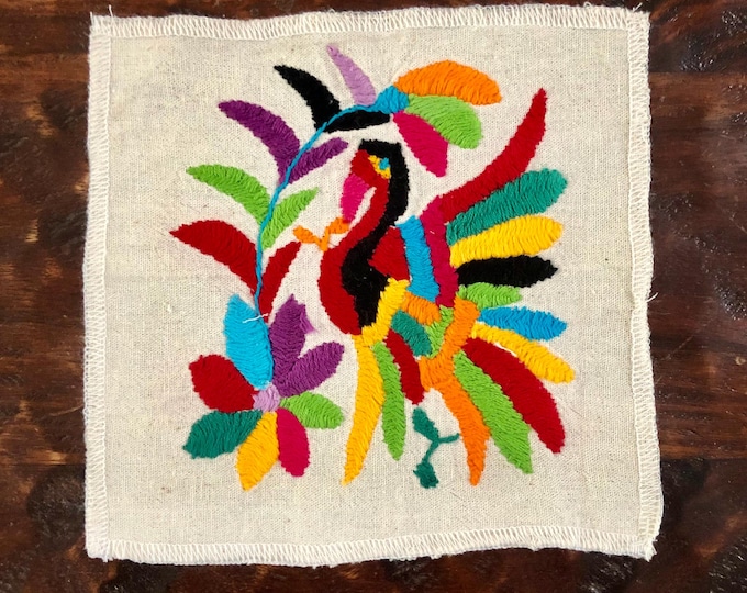 Otomi hand embroidered muslin coaster / cocktail napkin / frame-able art with multicolored bird and flowers.