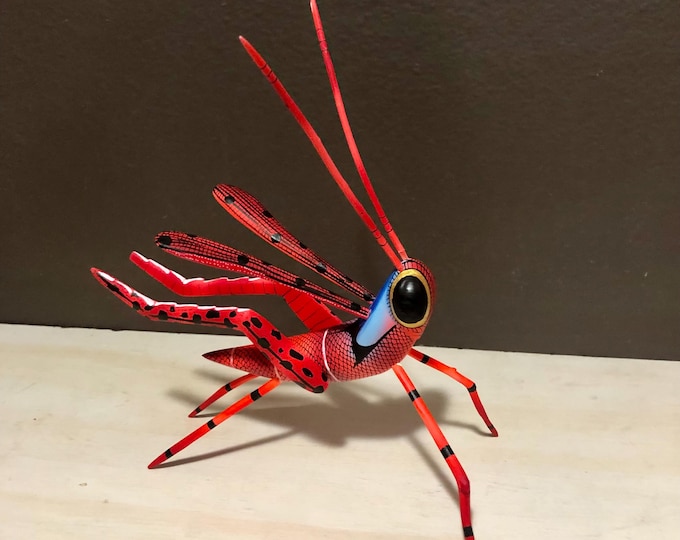 Alebrije Red and Orange Grasshopper Handcrafted Wood Carving by Zeny Fuentes and Reyna Piña from Oaxaca, Mexico.