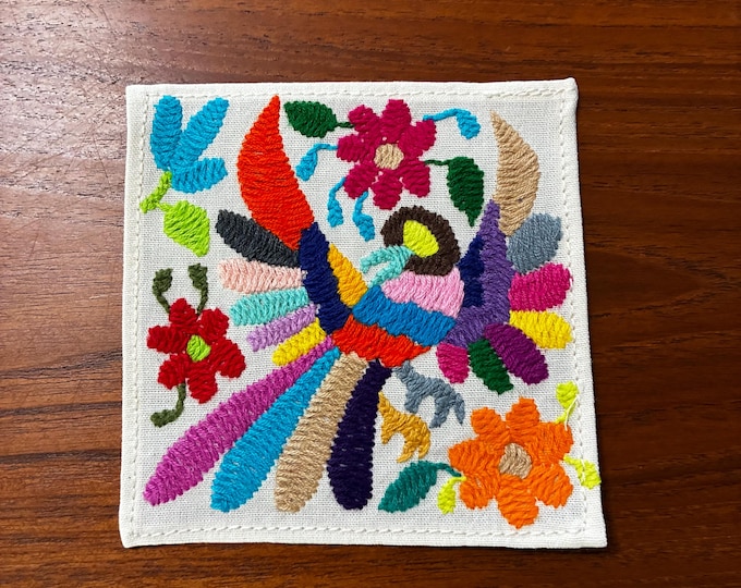 Otomi hand embroidered muslin cotton coaster / cocktail napkin / frame-able art with multicolored bird and flowers. (4 1/4” x 4 1/4”)
