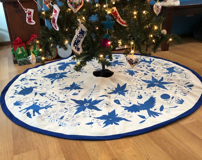 5’ Hand Embroidered Otomi Christmas Tree Skirt on off white muslin cotton with spanish blue  embroidery and border from Hidalgo, Mexico.