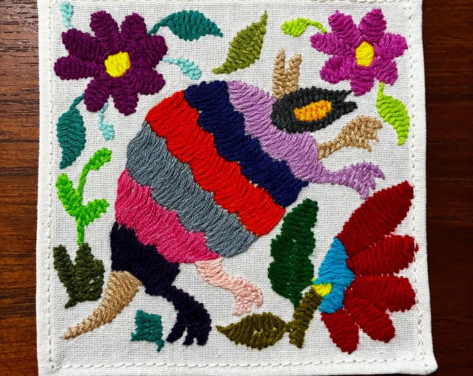 Otomi hand embroidered muslin cotton coaster / cocktail napkin / frame-able art with multicolored animal and flowers. (4 1/4” x 4 1/4”)