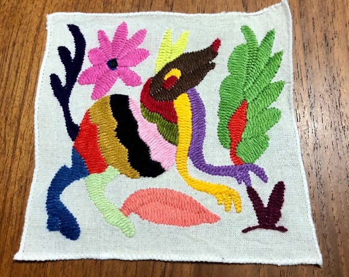 Otomi hand embroidered muslin coaster/cocktail napkin/frame-able art with multicolor spirit animal and flower design approx.  (5” x 5”)