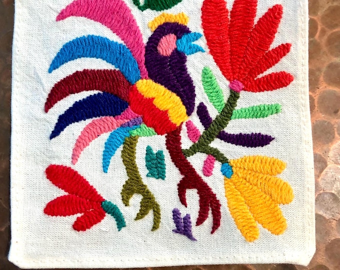 Otomi hand embroidered muslin coaster with multicolored bird and flowers.