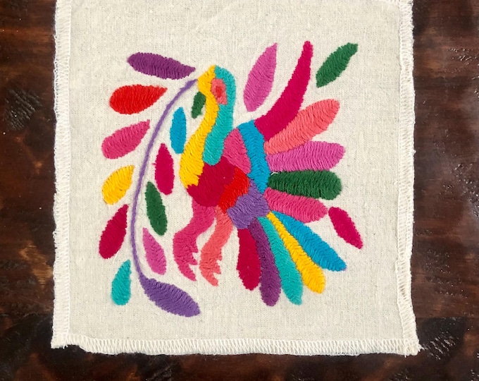 Otomi hand embroidered muslin coaster / cocktail napkin / frame-able art with multicolored bird and flowers.