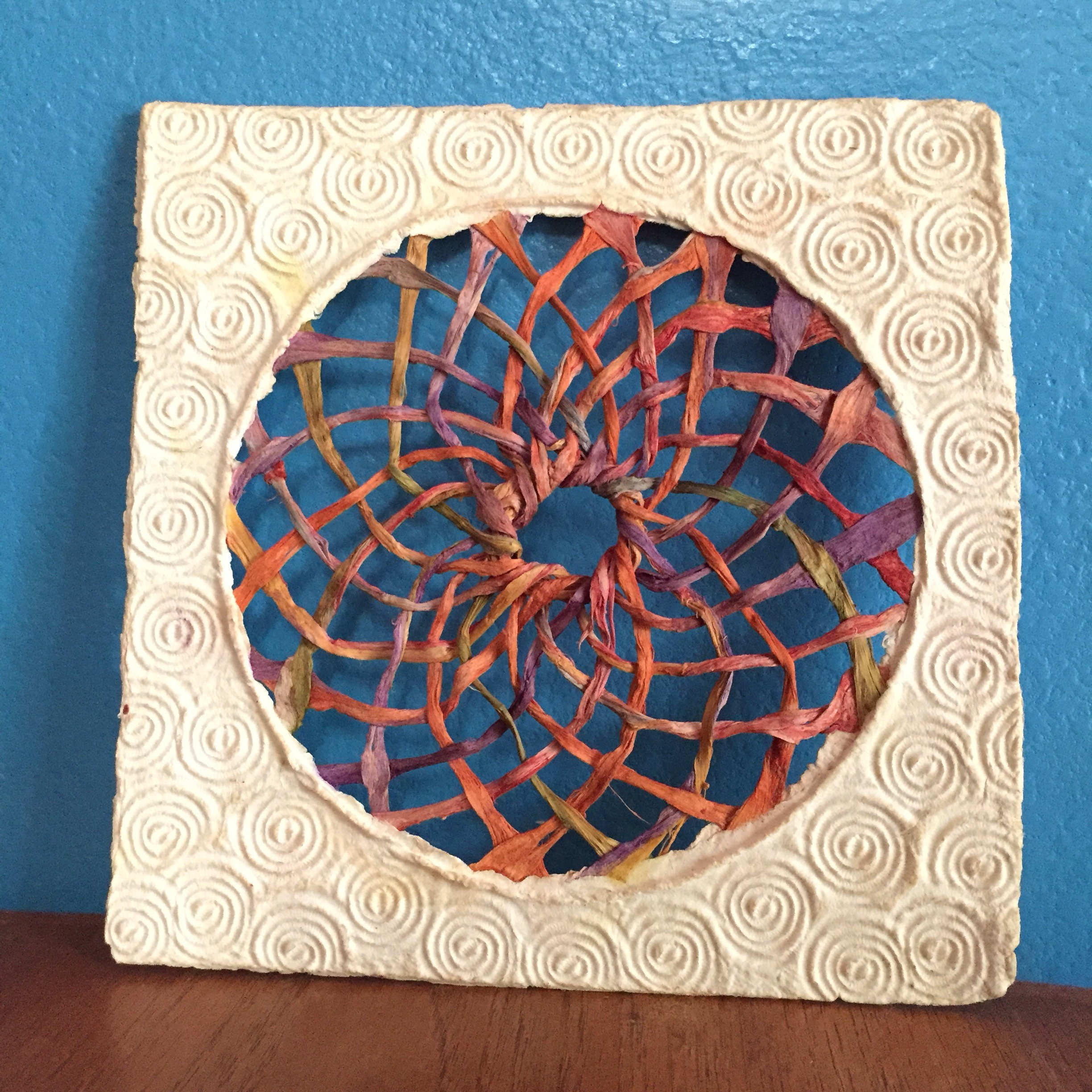 Handmade Amate Paper Wall Art with multicolor woven sphere