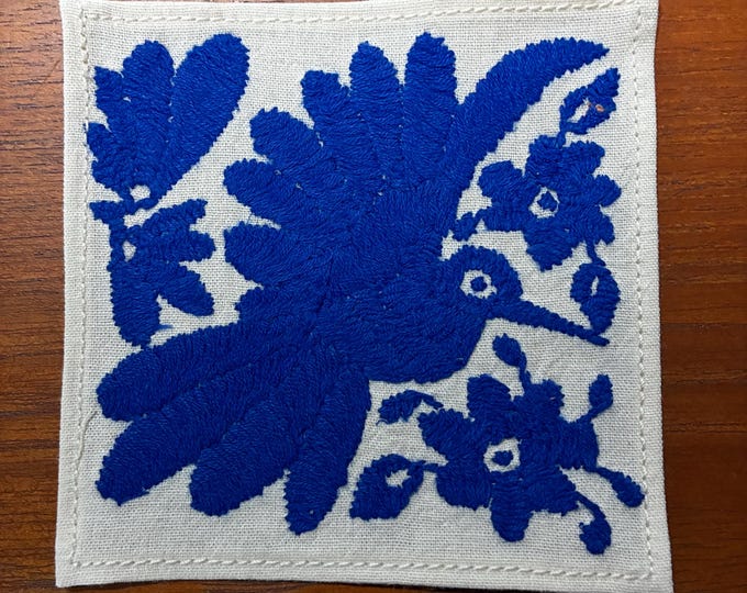 Otomi hand embroidered muslin cotton coaster / cocktail napkin / frame-able art with blue bird and flowers. (4 1/4” x 4 1/4”)