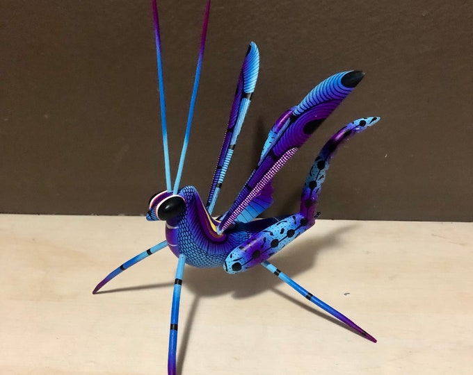 Alebrije Blue Grasshopper Handcrafted Wood Carving by Zeny Fuentes and Reyna Piña from Oaxaca, Mexico.
