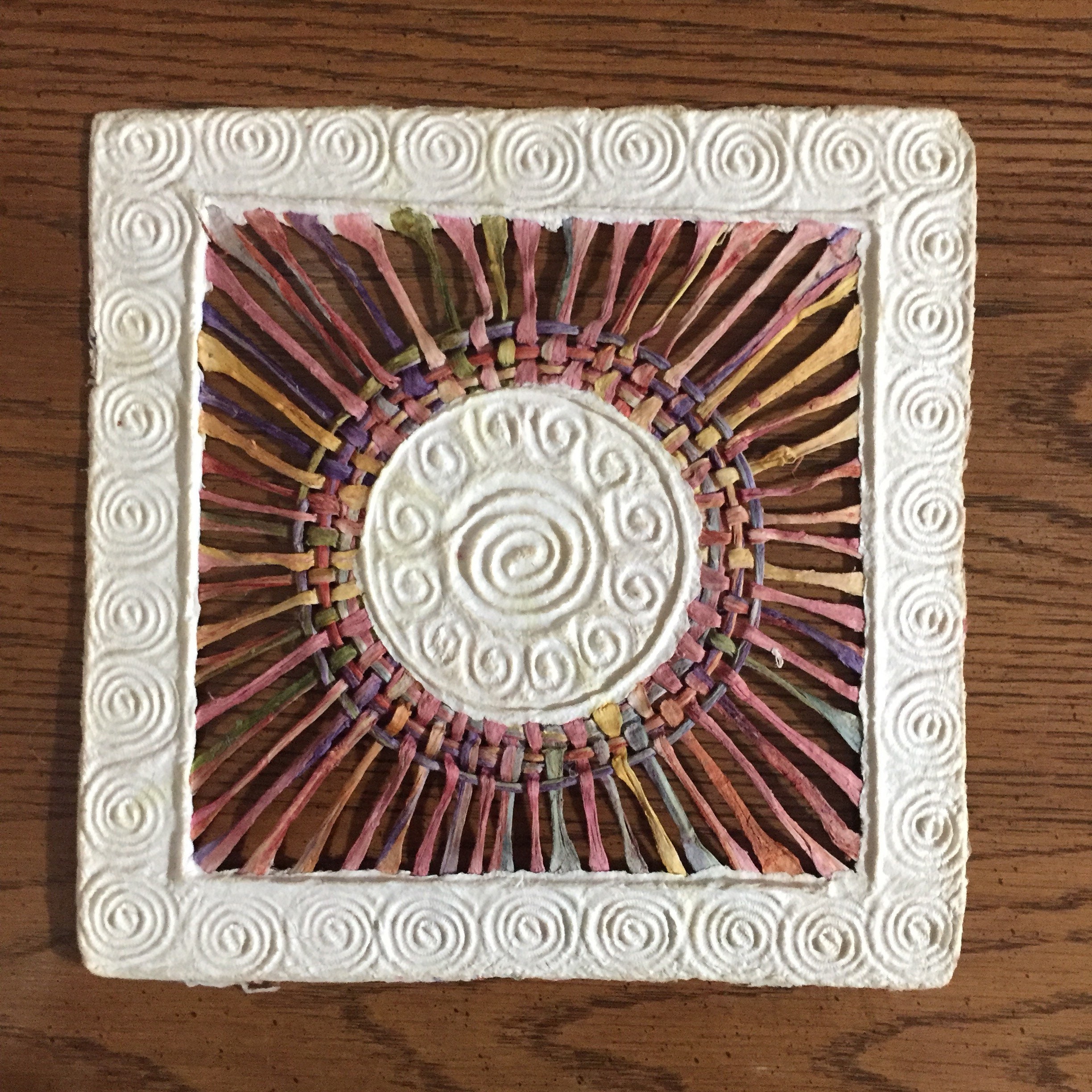 Handmade Amate Paper Wall Art with multicolor woven circle with spiral