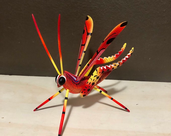 Alebrije Orange Grasshopper Handcrafted Wood Carving by Zeny Fuentes and Reyna Piña from Oaxaca, Mexico.