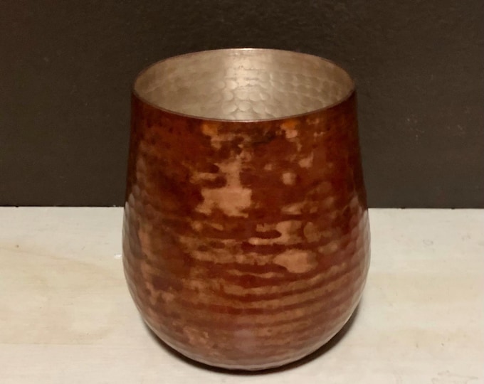 Hammered copper stemless wine glass with red patina finish