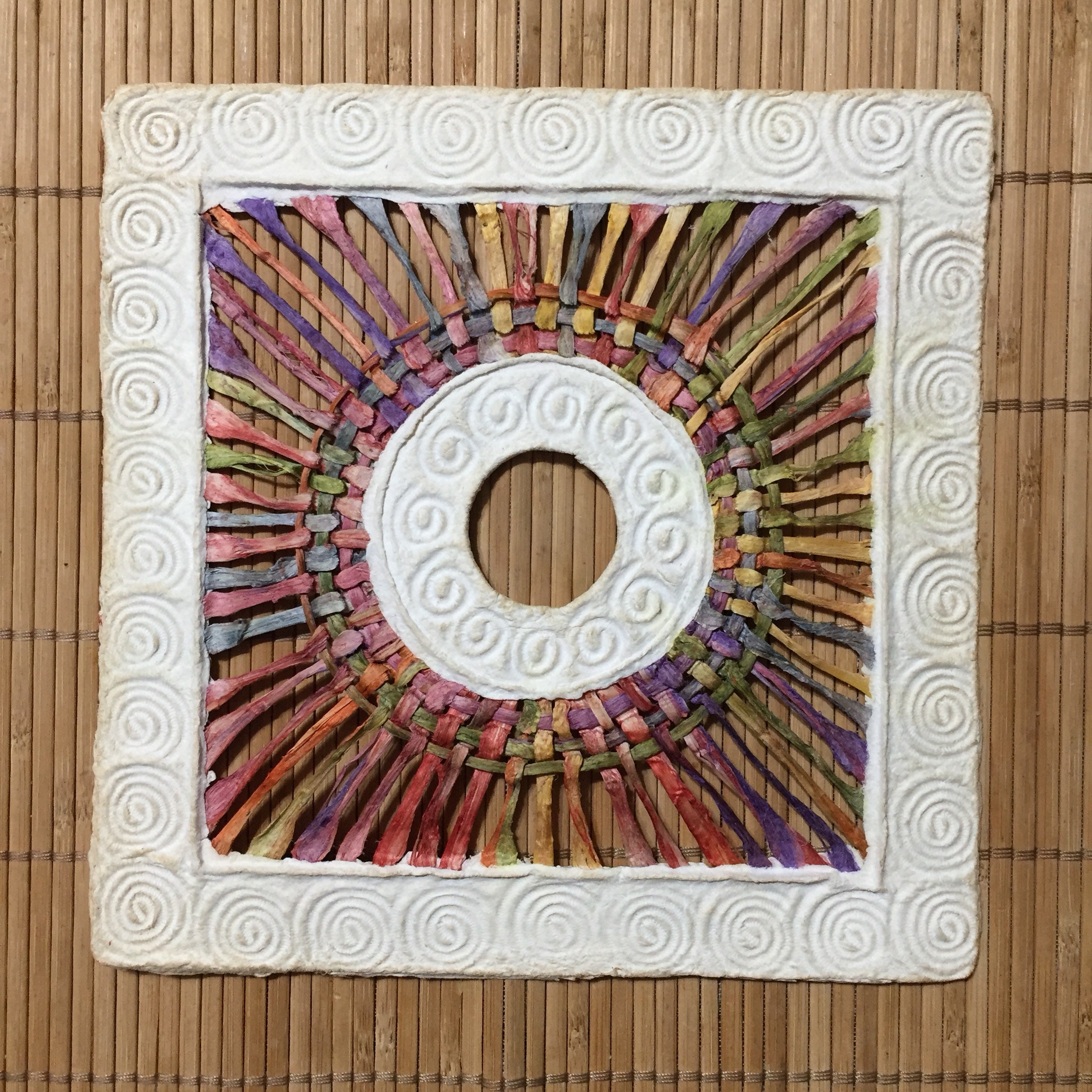 Handmade Amate Paper Wall Art with multicolor woven circle
