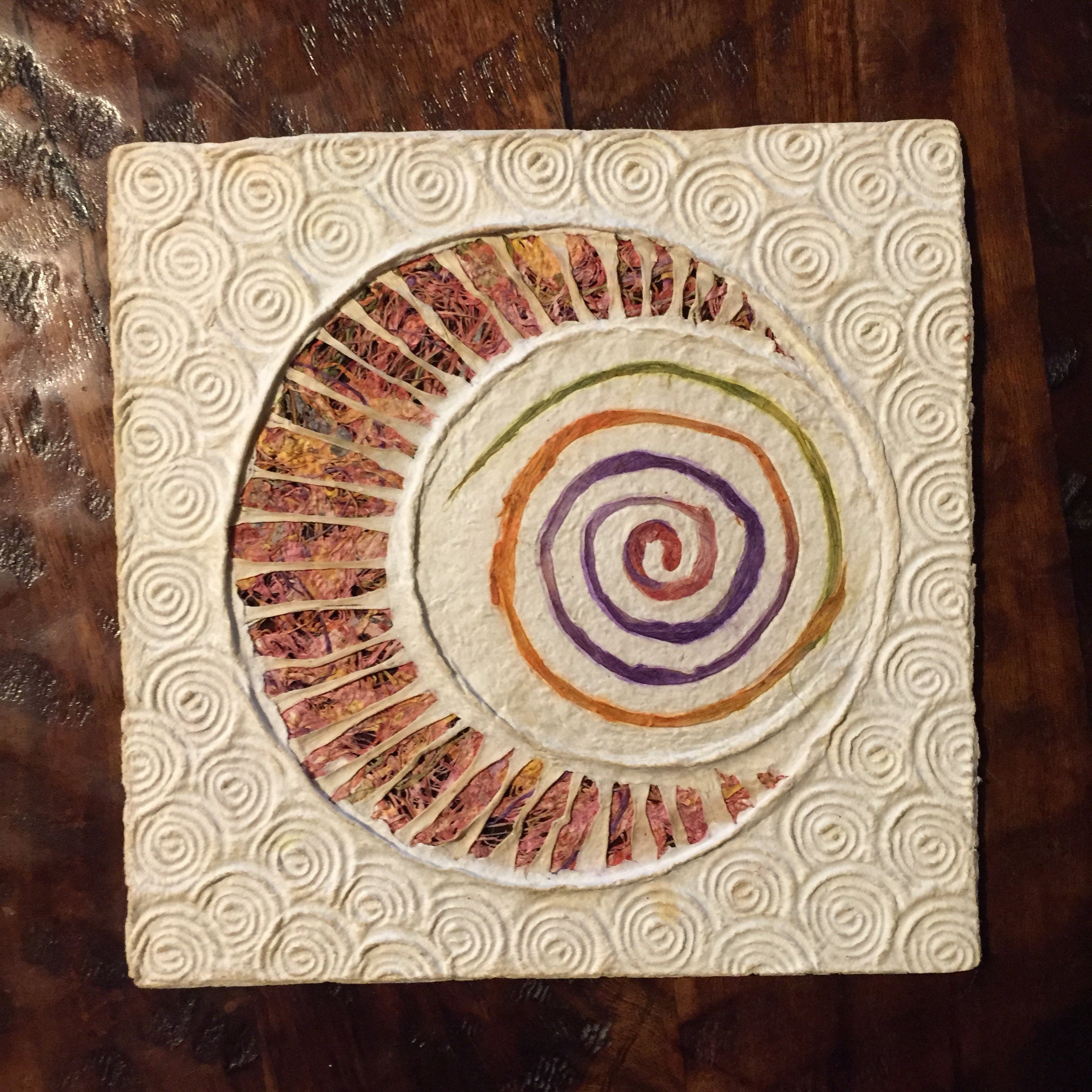 Handmade Amate Paper Wall Art with multicolor woven moon and spiral