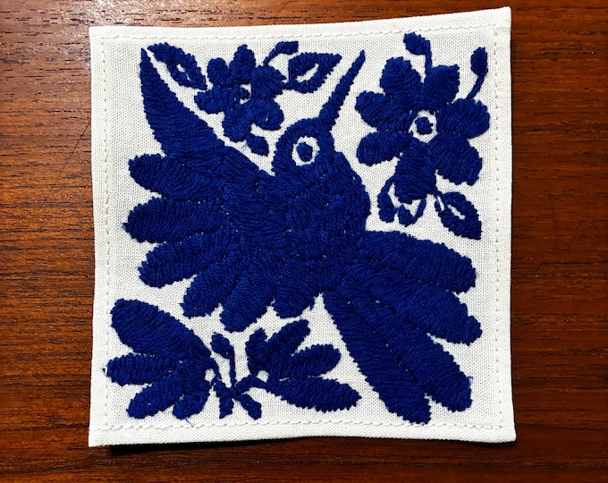 Otomi hand embroidered muslin cotton coaster / cocktail napkin / frame-able art with blue bird and flowers. (4 1/4” x 4 1/4”)
