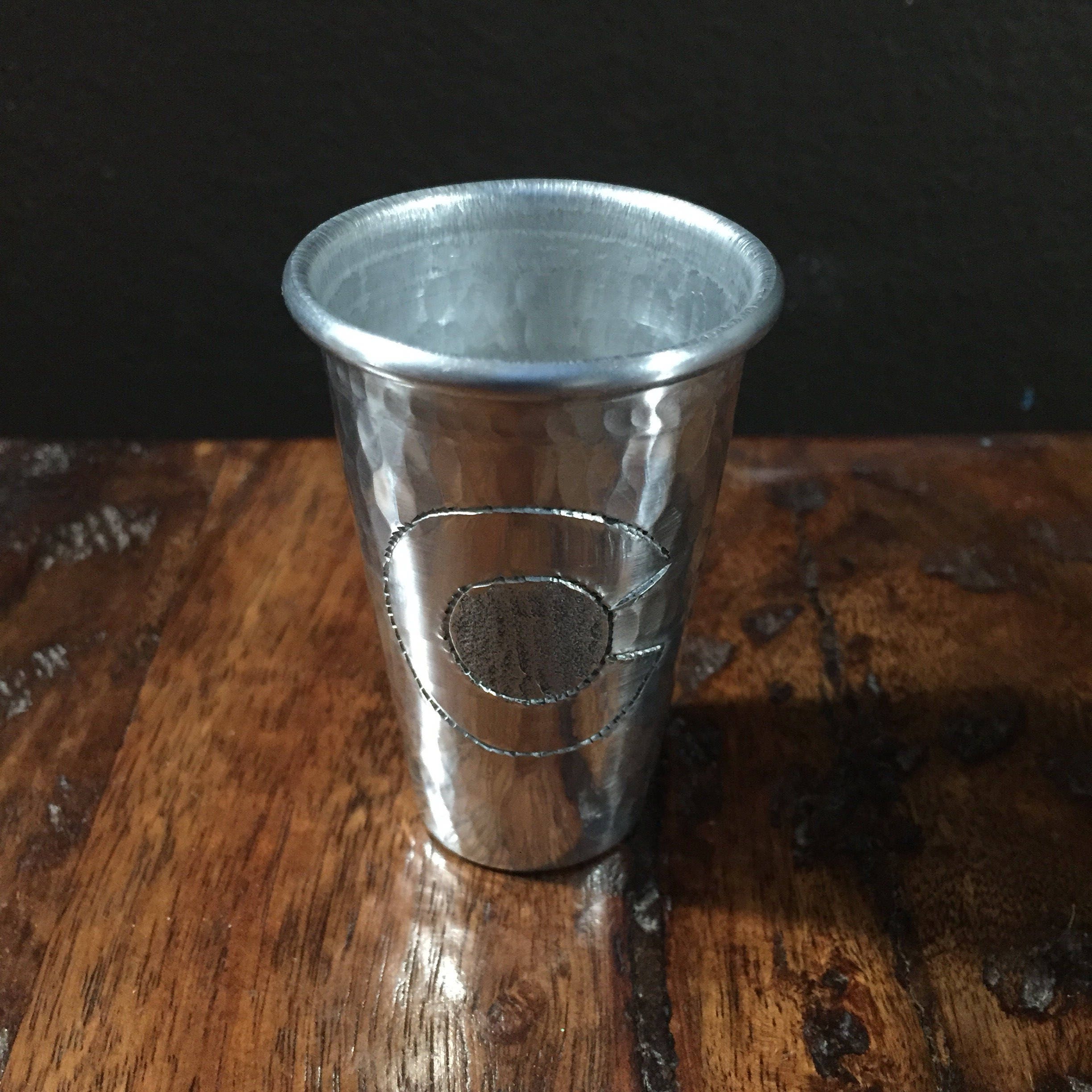 Handcrafted 2oz hammered aluminum shot glass with Colorado C engraved