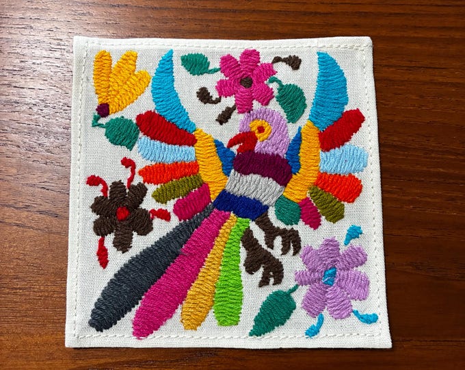 Otomi hand embroidered muslin cotton coaster / cocktail napkin / frame-able art with multicolored bird and flowers. (4 1/4” x 4 1/4”)
