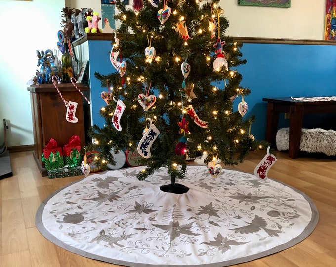 5’ Diameter Hand Embroidered Otomi Christmas Tree Skirt on white muslin cotton with silver grey embroidery and border from Hidalgo, Mexico.