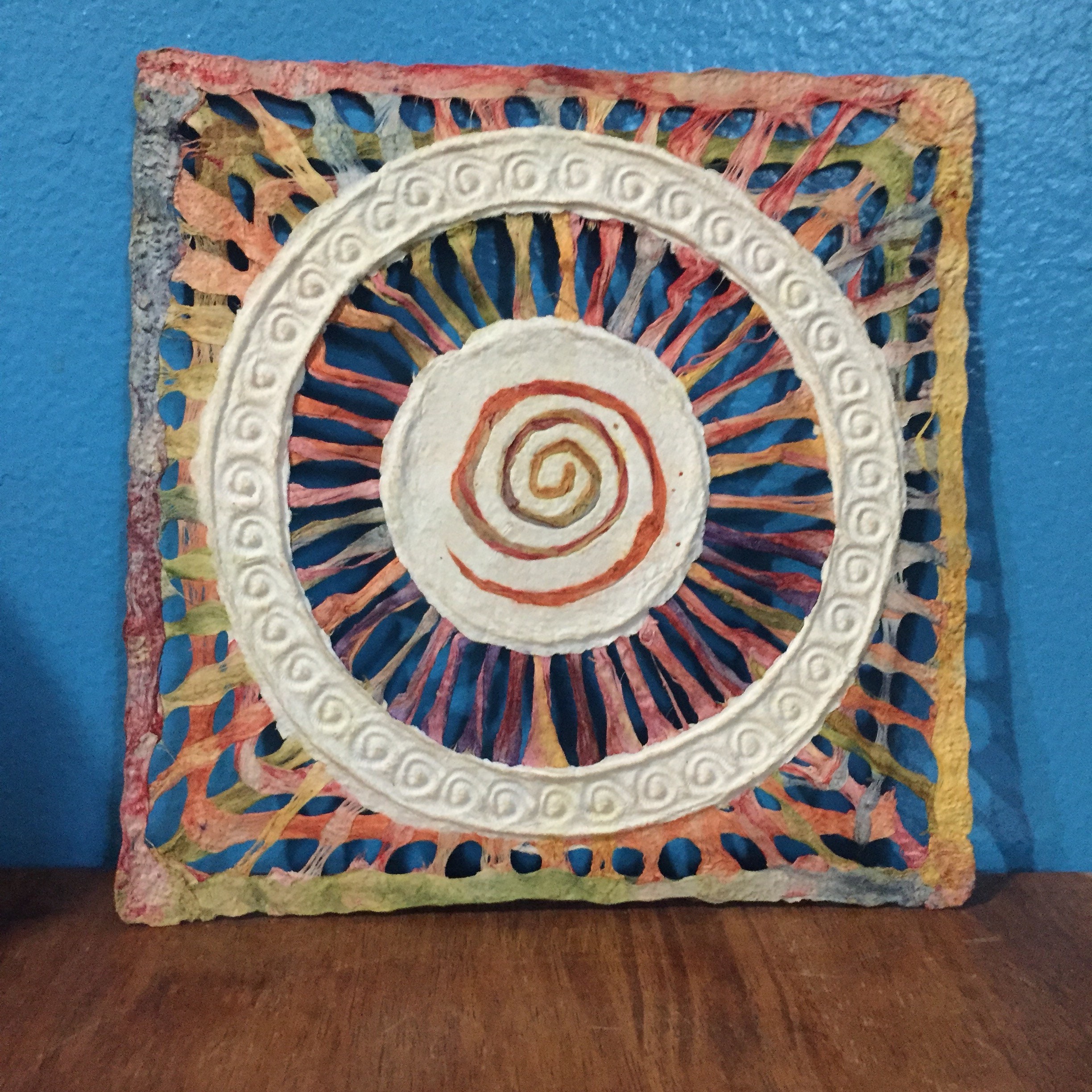 Handmade Amate Paper Wall Art with multicolor woven circle with spiral