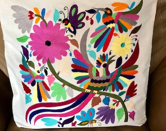 Otomi hand embroidered 19” x 19” pillow case with spirit animals and flowers.