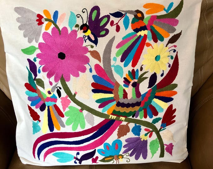 Otomi hand embroidered 19” x 19” pillow case with spirit animals and flowers.