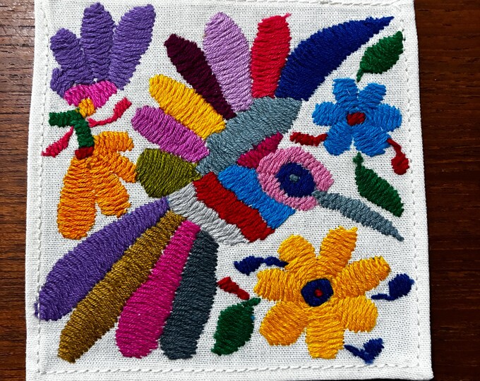 Otomi hand embroidered muslin cotton coaster / cocktail napkin / frame-able art with multicolored bird and flowers. (4 1/4” x 4 1/4”)