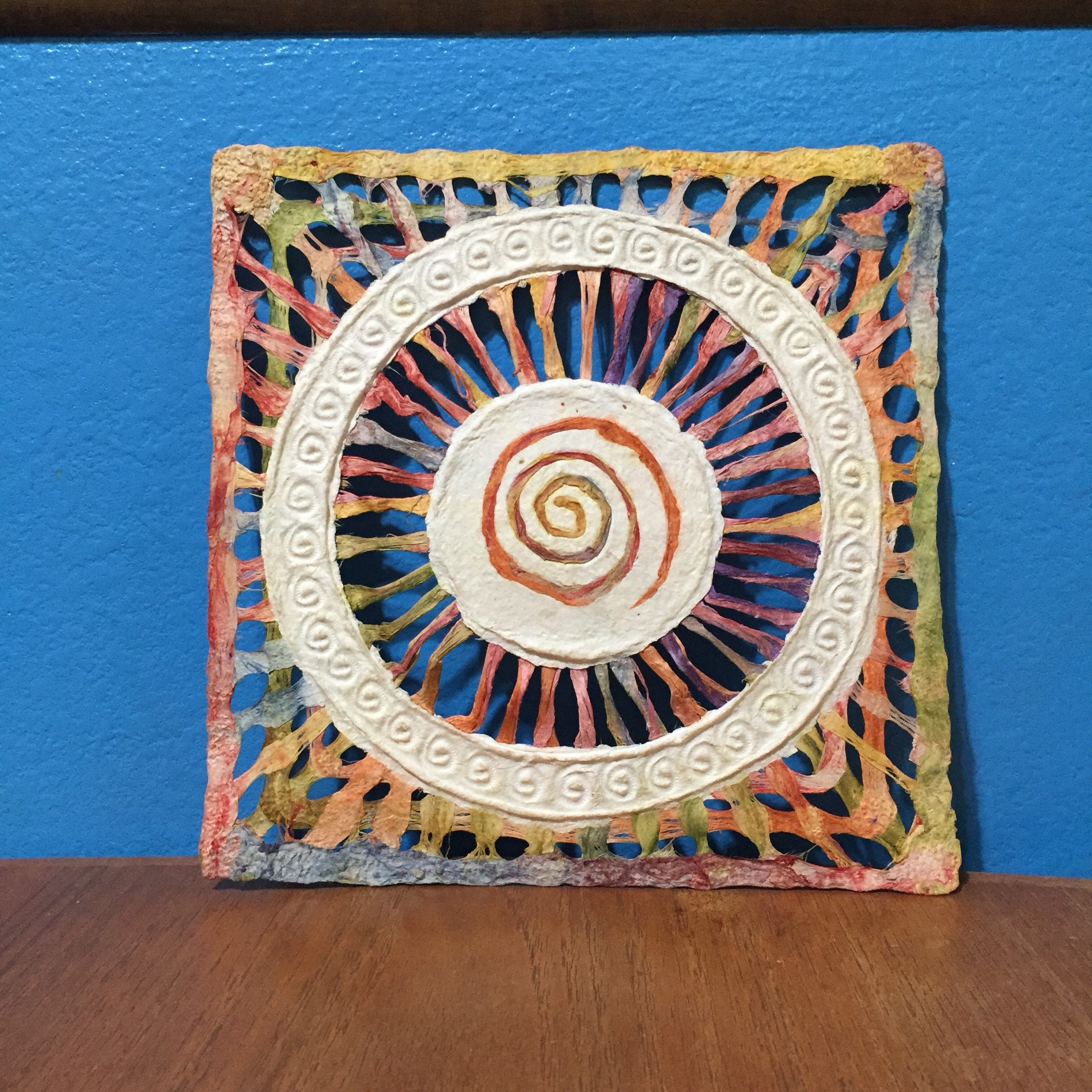 Handmade Amate Paper Wall Art with multicolor woven circle with spiral