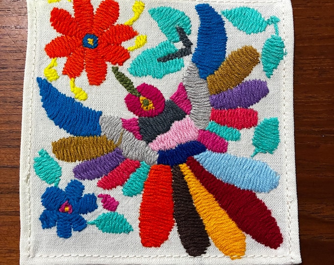 Otomi hand embroidered muslin cotton coaster / cocktail napkin / frame-able art with multicolored bird and flowers. (4 1/4” x 4 1/4”)