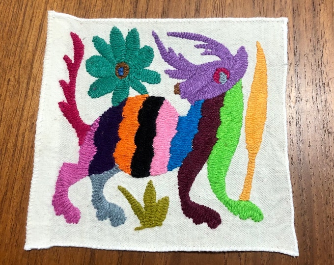 Otomi hand embroidered muslin coaster/cocktail napkin/frame-able art with multicolor spirit animal and flower design approx.  (5” x 5”)