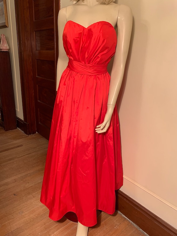 Red strapless gown alyce designs