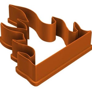 May include: A brown plastic cookie cutter in the shape of a stylized flame. The cutter has a rectangular base and curved edges, with a smooth, clean finish. The design is suitable for baking and crafting.