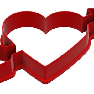 May include: A red plastic cookie cutter in the shape of a heart pierced by an arrow. The arrow's fletching and arrowhead are clearly defined. The cutter is designed for baking and crafting, perfect for Valentine's Day or other romantic occasions.